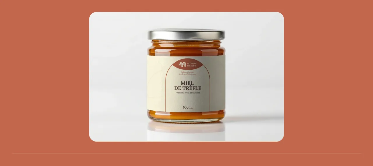 Pot de miel de trèfle Artisanat de Saba, étiquette crème à l'arche terre cuite et couvercle métallique